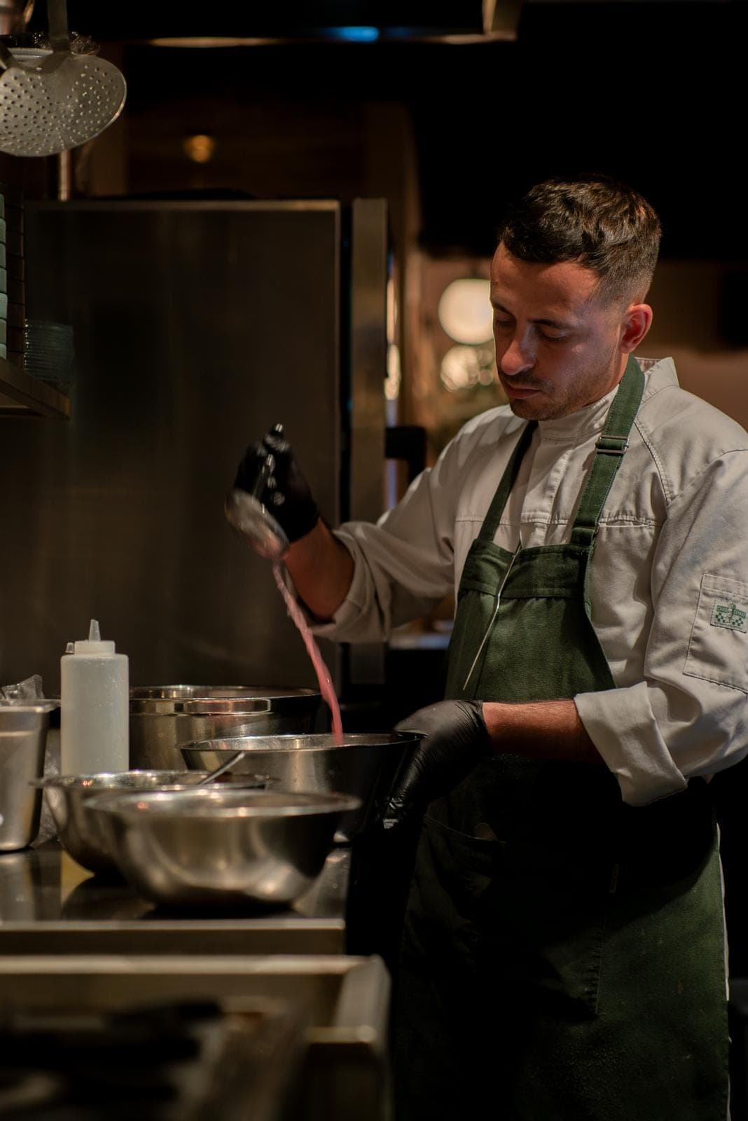 Chef Alejandro Torres preparing a dish in the kitchen