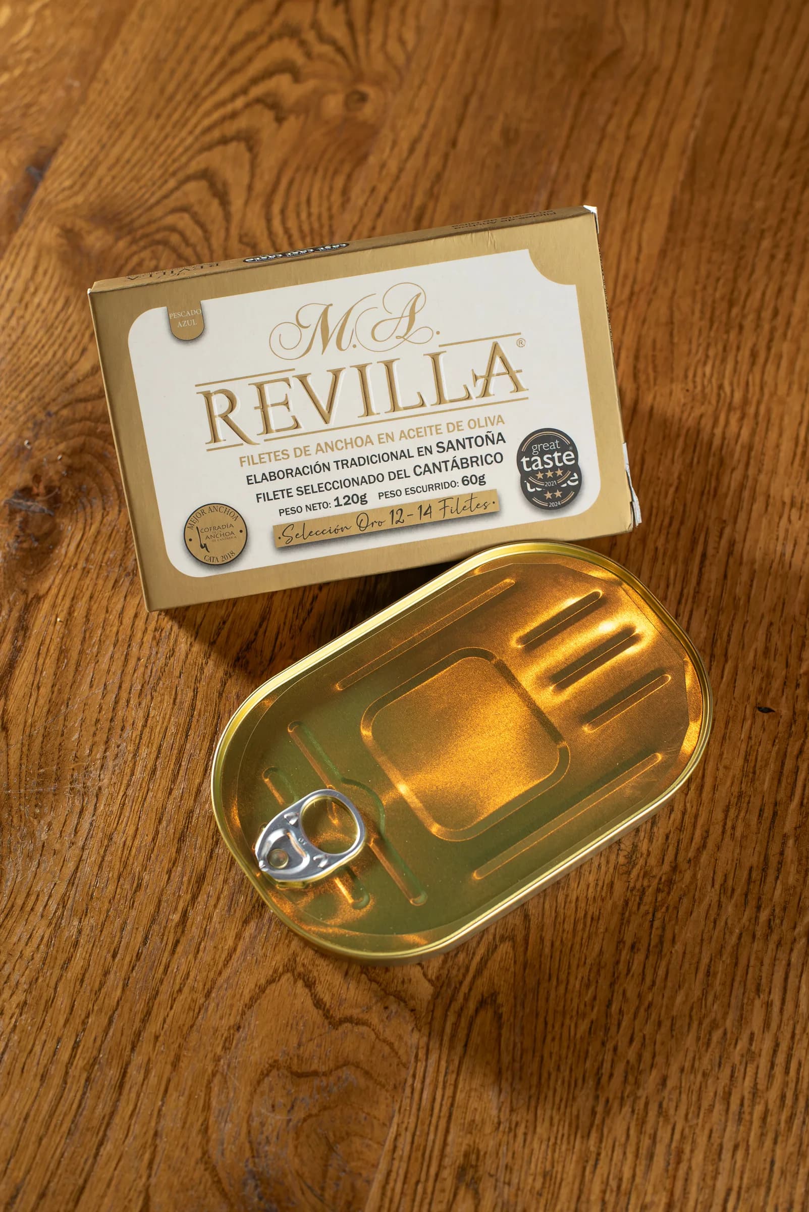 Gold box of M.A. Revilla Cantabrian anchovy fillets in olive oil.